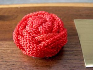 Ball of red rope from Arts of the Sailor